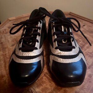 Black Leather Reeboks in pristine condition, Gold accents.